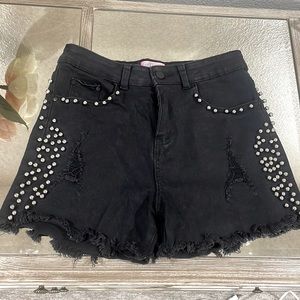 Gina’s Tees black studded shorts.